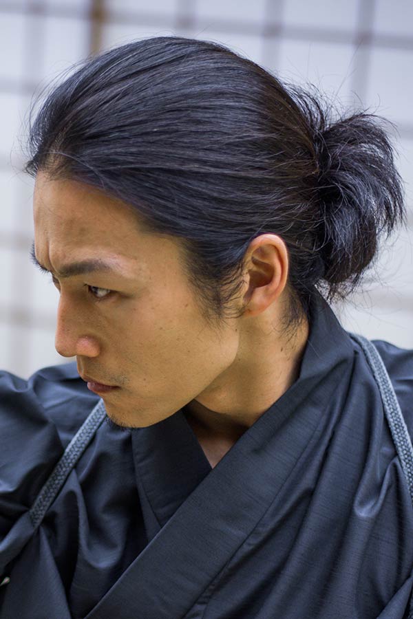 Premium Photo | Masculine Japanese Guy with Trendy Hairstyle Looking at  Camera with Black Tshirt