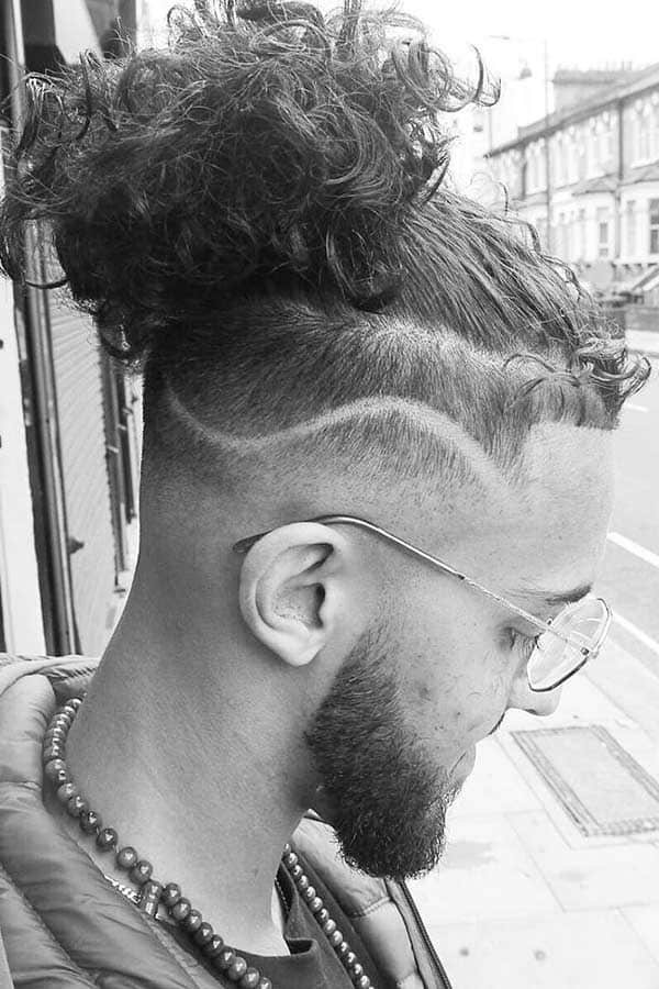 Curly Undercut With Man Bun #undercut #curlyundercut #curlyhairmen #menshaircuts #fadehaircut