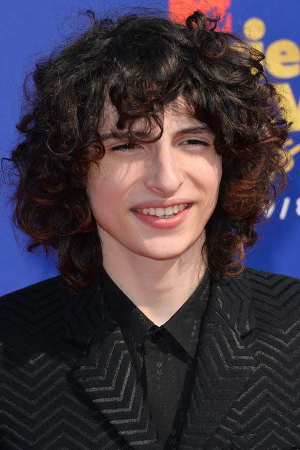 Finn Wolfhard’s Medium To Long Unruly Locks #surferhair #longhairmen #menshairstyles #beachwaves