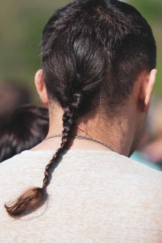 Premium AI Image | Girl's back showing her hairstyle topsy tail braid