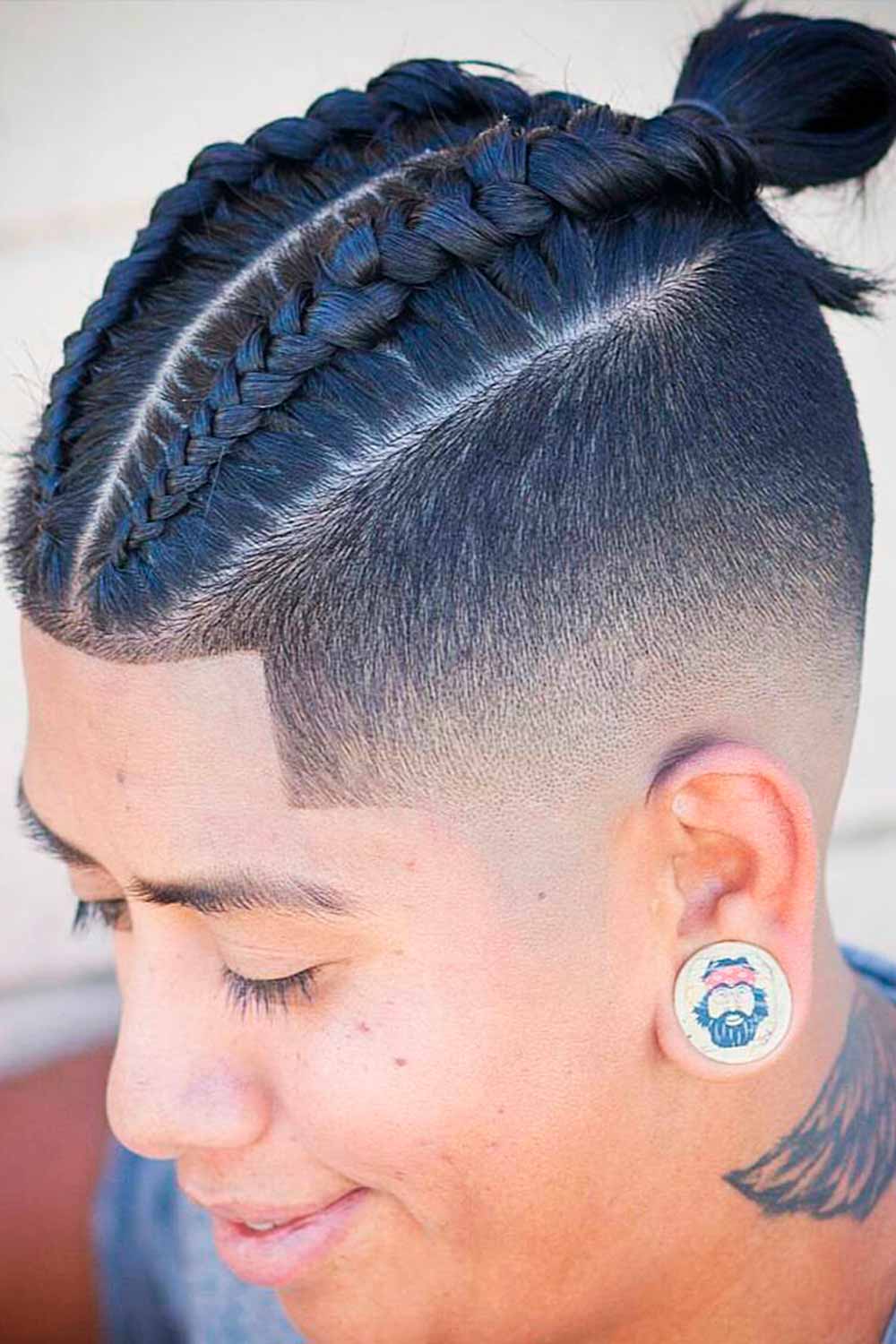 https://menshaircuts.com/wp-content/uploads/2022/05/braids-for-men-bun-french-double-undercut-bald-fade.jpg