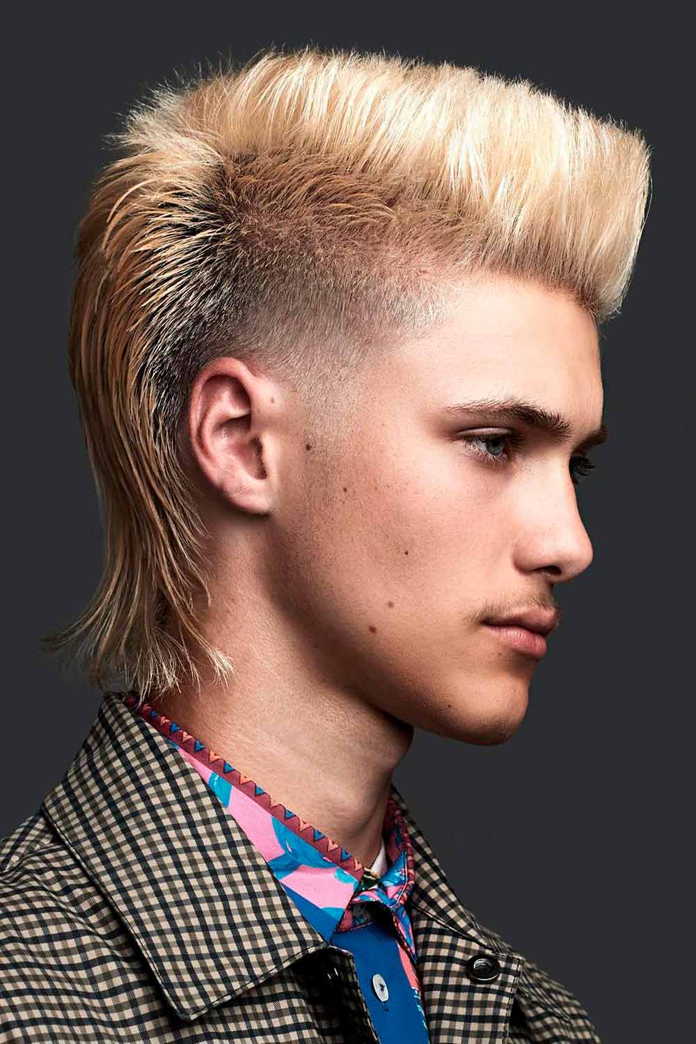 Image of Blonde shaggy mullet with a pompadour