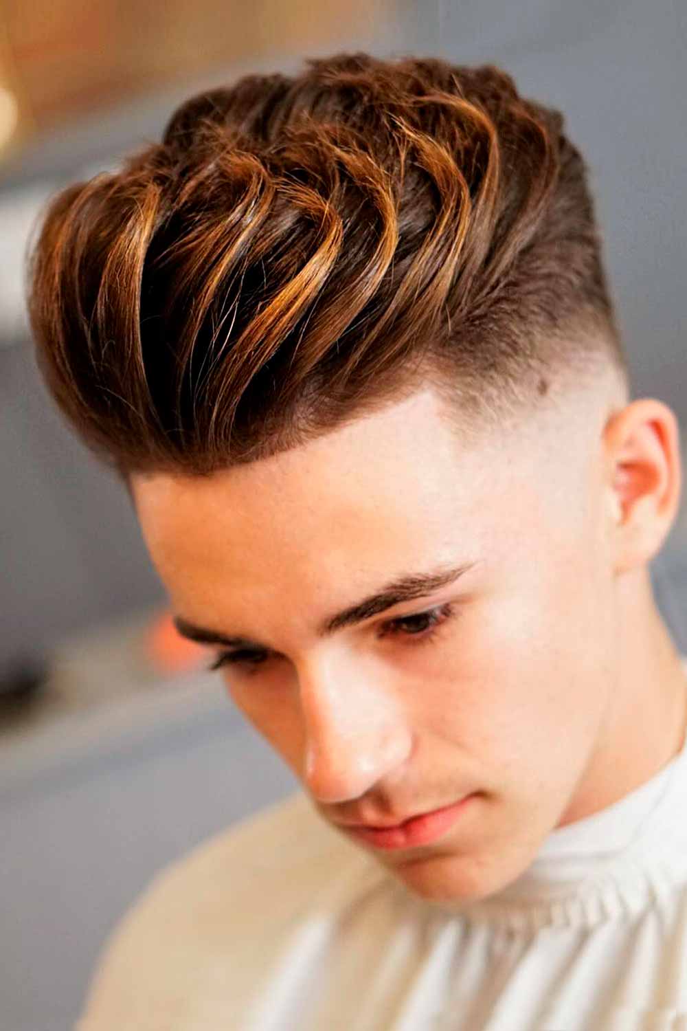 undercut fade brushed back highlights