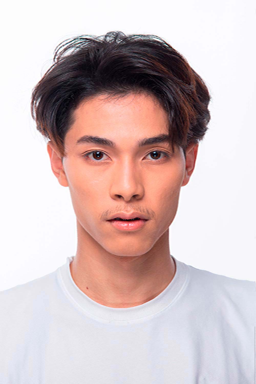 Image of Middle part fade korean hairstyle for oval face