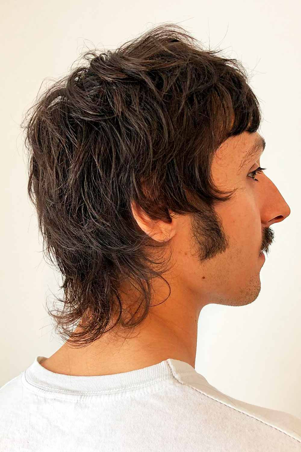 Image of Wavy wolf cut mullet with center part