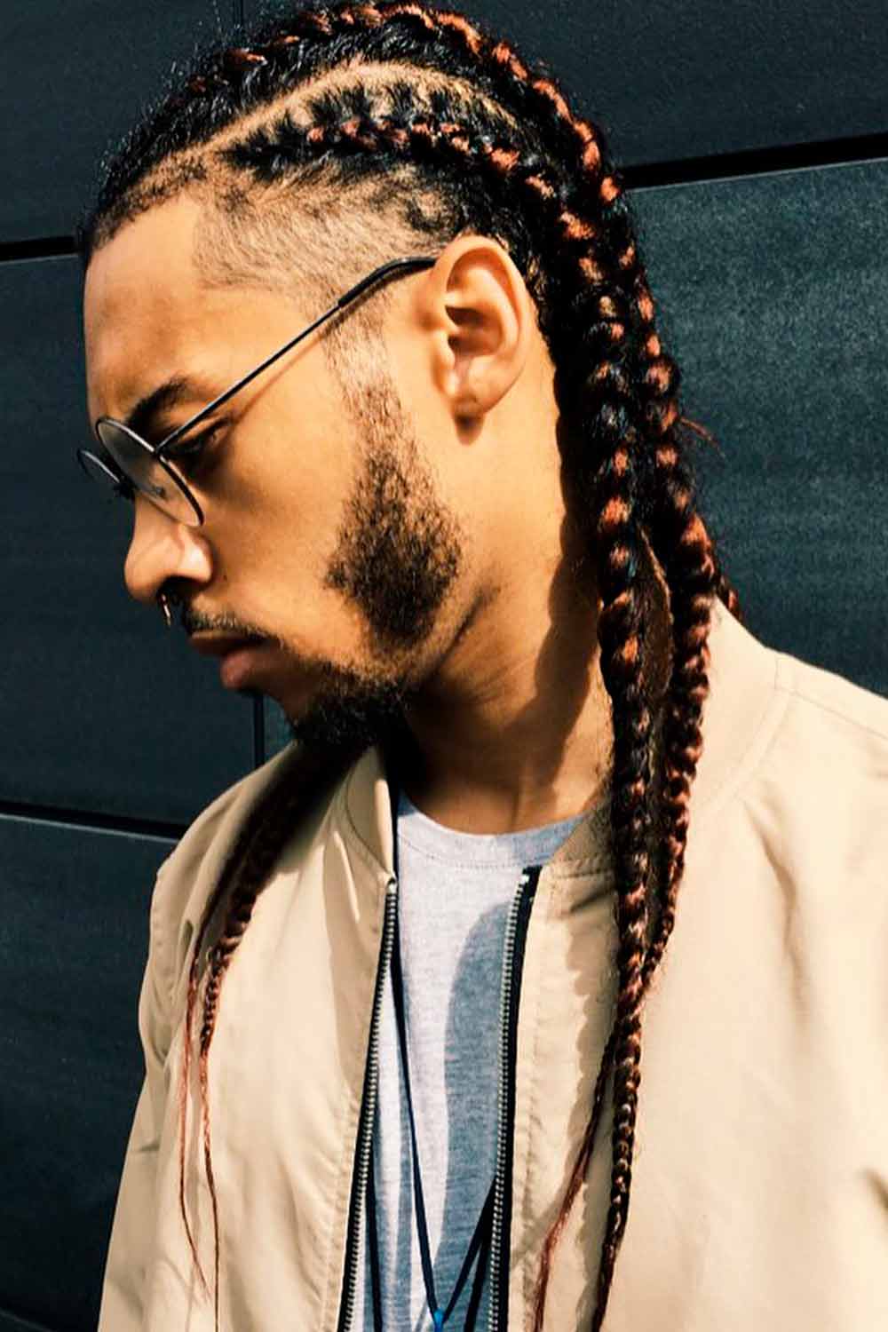 A picture of a black guy with a long cornrows hairstyle braided through his  kinky curly hair at a barbershop - Long Hair Guys